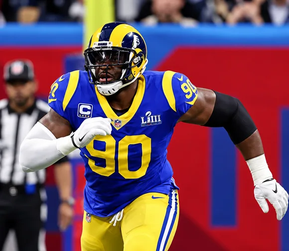 Michael Brockers in action in a Los Angeles Rams blue and gold number 90 uniform